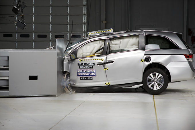 The 2014 Honda Odyssey is tested during the Insurance Institute for Highway Safety's small overlap frontal crash test. Photo courtesy of the Insurance Institute for Highway Safety.