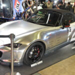 【画像】クルマが横倒しでマフラーまる見え！　フジツボブースの展示は技術力もまる見えだった【東京オートサロン2026】 〜 画像7
